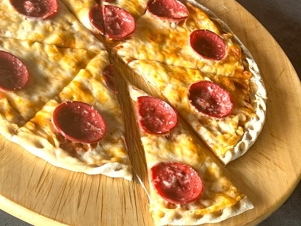 Pepperoni Pizza (CALORIES: 375 PROTEINS: 22 Grams FATS: 27 Grams)
